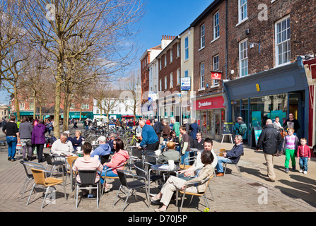 People sat at a pavement cafe Parliament street York city centre York  North Yorkshire England GB UK EU Europe Stock Photo