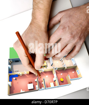 Close-up of hands with pencils over a draft Stock Photo