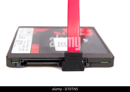 solid-state drive (SSD) and SATA cable on white background Stock Photo