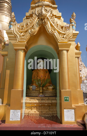 A Buddha statue at Shwedagon Pagoda, Yangon, (Rangoon), Myanmar, (Burma) Stock Photo