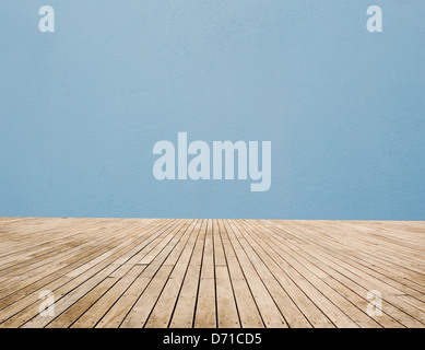 Wood Floor And Blue Wall Stock Photo