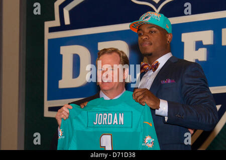 Dion Jordan, defensive end from Oregon, holds up a Dolphins Jersey after  the Miami Dolphins select him as the #3 overall pick in the 2013 NFL Draft  at Radio City Music Hall