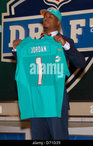 New York City, New York, USA. 25th April, 2013. Dion Jordan, defensive end from Oregon and drafted with the 3rd pick by Miami Dolphins, holding up his new jersey during the 78th National Football League Draft at Radio City Music Hall in New York City, New York. Stock Photo