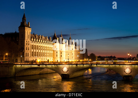 The Pont au Change, bridge over river Seine and the Conciergerie, a former royal palace and prison in Paris, France Stock Photo