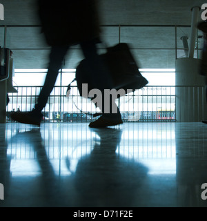 abstract airport and silhouette of walking person with luggage