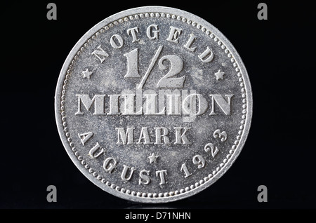 Coin with label 1/2 million DM, Hyperinflation Stock Photo