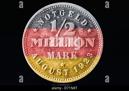 Coin with label 1/2 million DM in German national colours, symbolic photo inflation Stock Photo