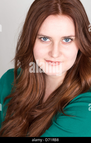 Young Reheaded Woman Smiling at Camera Stock Photo