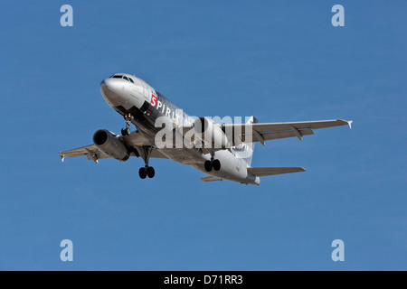 An Airbus A319 of Spirit airlines on final approach Stock Photo