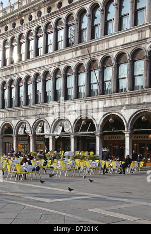 One of the outdoor pavement cafes in front of the Procuratie Vecchie in St Marks Square or Piazza San Marco Venice Italy Stock Photo