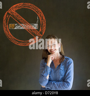 No smoking tobacco addict business woman, student or teacher on blackboard background Stock Photo