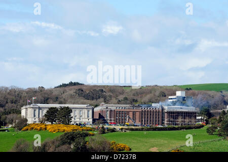 Aberystwyth, UK. 26th April 2013. Flames and smoke were seen coming from the roof at the building's rear and up to 300 staff and 100 visitors were evacuated from the building.  More than 30 firefighters are there, but reports by early Friday evening suggest the fire is less severe.  Senior library staff said it was not known how the fire started but everyone was safe. Credit: Andrew Chittock/Alamy Live News Stock Photo