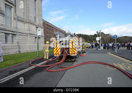 Aberystwyth, UK. 26th April 2013. Flames and smoke were seen coming from the roof at the building's rear and up to 300 staff and 100 visitors were evacuated from the building.  More than 30 firefighters are there, but reports by early Friday evening suggest the fire is less severe.  Senior library staff said it was not known how the fire started but everyone was safe.  Start Quote It is not just important to the academic life of the town, it is important to the cultural life of the whole of WalesÓ End Quote  Dylan Lewis  Mayor of Aberystwyth   Arwel Jones, director of public services at the li Stock Photo