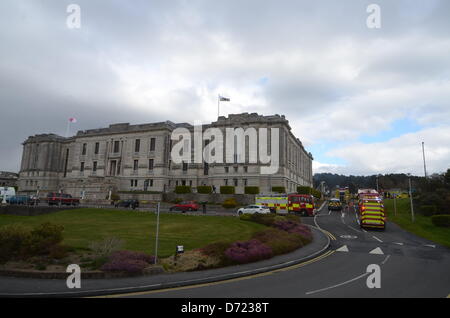 Aberystwyth, UK. 26th April 2013. Flames and smoke were seen coming from the roof at the building's rear and up to 300 staff and 100 visitors were evacuated from the building.  More than 30 firefighters are there, but reports by early Friday evening suggest the fire is less severe.  Senior library staff said it was not known how the fire started but everyone was safe.Credit: Andrew Chittock/Alamy Live News Stock Photo