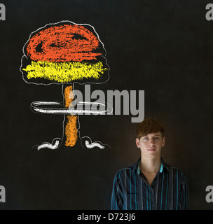 Business man, student or teacher with thought thinking chalk nuclear bomb cloud on blackboard background Stock Photo