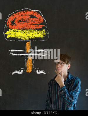 Business man, student or teacher with thought thinking chalk nuclear bomb cloud on blackboard background Stock Photo