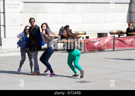 Trafalgar Square, London, UK, 25th April 2013. This pigeon scaring harrier hawk sends a group of teenage girls into a panic in Trafalgar Square. Credit:  Michael Smith/Alamy Live News Stock Photo
