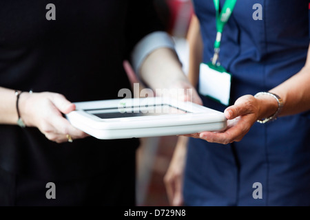 nurse using apple ipad in protective case Stock Photo