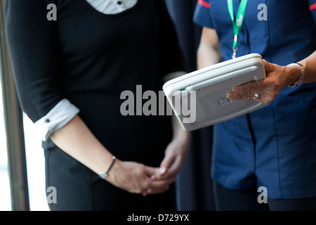 nurse using apple ipad in protective case Stock Photo