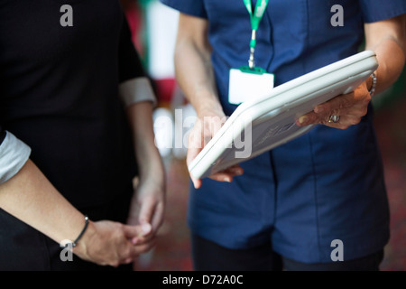 nurse using apple ipad in protective case Stock Photo