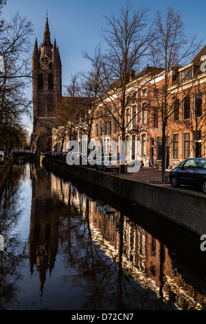 The leaning tower of the Old Church (Oude Kerk) reflected in a canal, Delft, The Netherlands Stock Photo