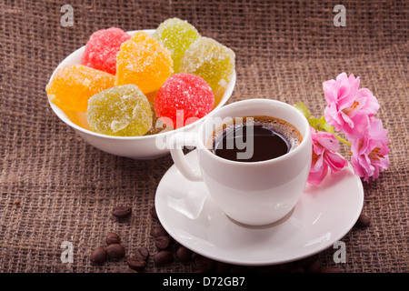 Flowers, coffee and sweets. Closeup Stock Photo