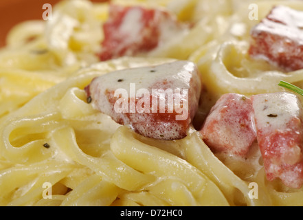 pasta Fettuccine Alfredo with sausage. close-up Stock Photo