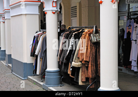 Maidstone, Kent, England, UK. Fur coats on a rack outside shop