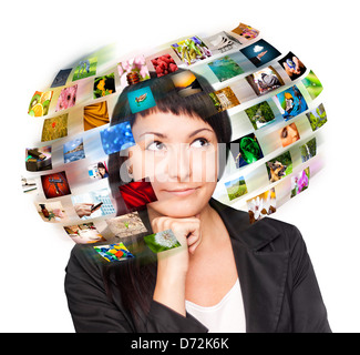 A technology woman has images around his head. Use it for a communication or tv concept. Stock Photo