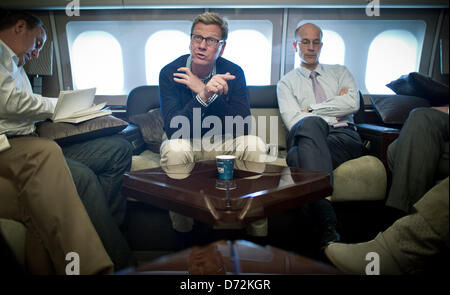 Accra, Ghana, 27 April 2013. German Minister of Foreign Affairs Guido Westerwelle sits in an aeroplane with his spokesman Andreas Peschke (R) in Berlin, Germany, 27 April 2013. Ghana is first station of Westerwelle's five days long trip to Africa. PHOTO: MICHAEL KAPPELER/DPA/Alamy Live News Stock Photo