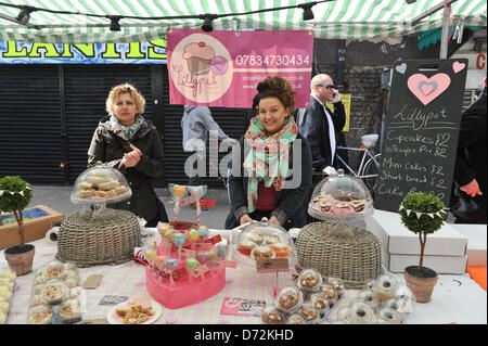 Brixton Market, London, UK. 27th April 2013.Two stallholders at the Brixton Bake Off. The Great Brixton Bake Off, 30 bakers present their finest cakes, biscuits and vegan bakes to a panel of judges. Credit: Matthew Chattle/Alamy Live News