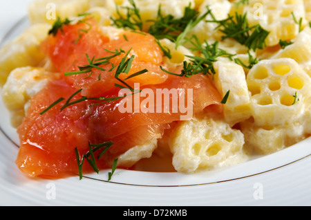 ruote pasta with cream sauce and salmon.closeup Stock Photo