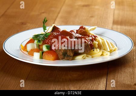 pasta with tomato beef sauce on wooden table Stock Photo