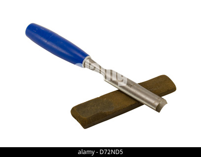 Round metallic chisel with plastic blue handle on whetstone isolated on white background. Stock Photo