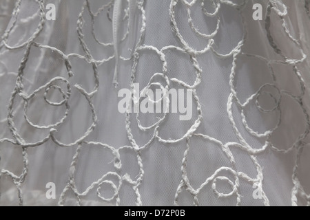 Close-up of hand-stitched wedding dress Stock Photo