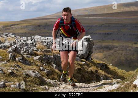 Yorkshire Three Peaks Challenge Saturday 27th April, 2013. Runner Mark Walker, Rochdale Harriers at the 59th Annual 3 Peaks Race with 1000 fell runners starting at the Playing Fields, Horton in Ribblesdale, Nr, Settle, UK.  Pen-y-Ghent is the first peak to be ascended then Whernside and finally the peak of Ingleborough. The race timed using the SPORTident Electronic Punching system. Stock Photo
