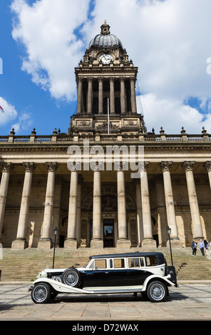 A vintage wedding car in front of the Town Hall, The Headrow, Leeds, West Yorkshire, UK Stock Photo