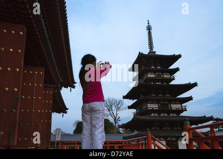 Girl photograph pagoda in Yakushiji Temple, Nara, Japan Stock Photo