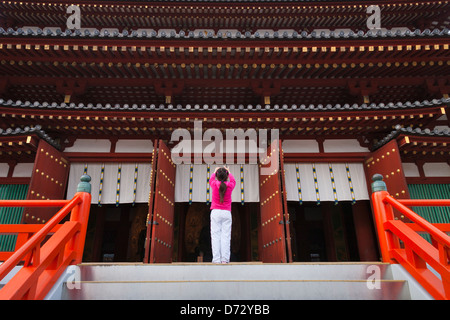 Girl photographing in Yakushiji Temple, Nara, Japan Stock Photo