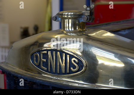 The polished brass bonnet radiator cap of a vintage Dennis fire engine at the Amberley Working Museum, Amberley, West Sussex, UK Stock Photo