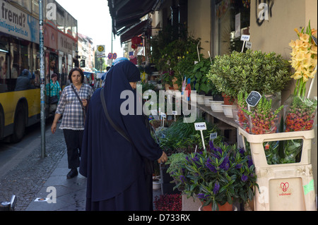 Berlin, Germany, passers-by in the corner of Orange Street Adalbertstrasse at a flower shop Stock Photo