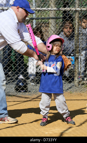 A little boy playing baseball t-ball tee ball. Hitting the ball Stock Photo  - Alamy