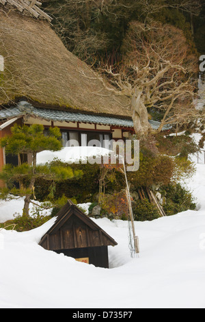 Traditional thatched roof house in the mountain covered by snow, Miyama-cho, Kyoto Prefecture, Japan Stock Photo