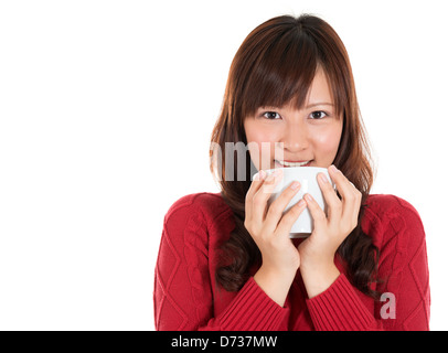 Beautiful mixed Asian woman drinking coffee or tea, isolated on white background Stock Photo