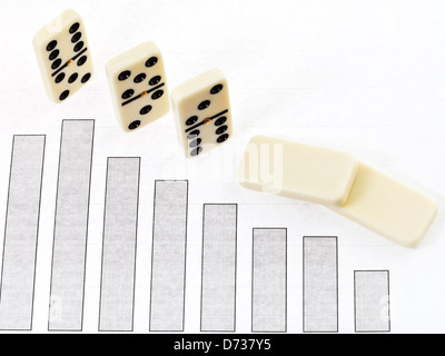 business concept - domino and diagram of decline economy results Stock Photo