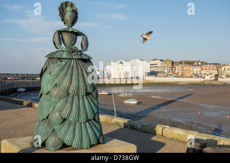 Mrs Booth The Shell Lady Sculpture by Ann Carrington on the Harbour Arm  Margate Kent England Stock Photo