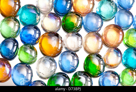 multicolored glass balls or marbles mix on white Stock Photo