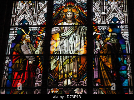 Stained glass window depicting Jesus Christ, Moses with the Ten Commandments and the Prophet Iesaiah. Stock Photo