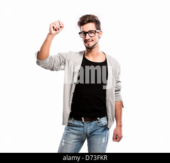 Portrait of a handsome young man wearing glasses and writing something on a glass writeboard Stock Photo