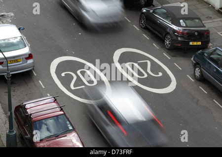 20 mph speed limit signs painted on the road surface in Hove, East Sussex. Stock Photo